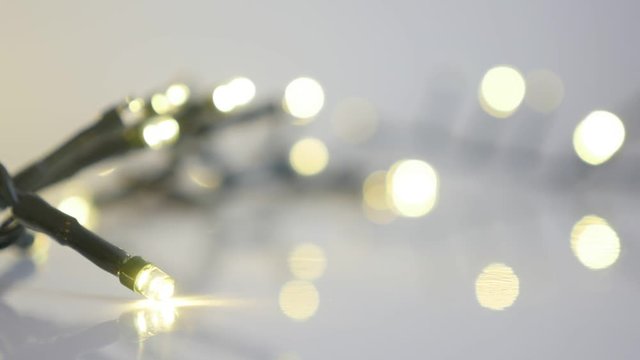 Close-up sequence of fairy-lights slow motion footage - Blinking Christmas decoration slow-mo
