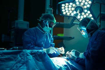Doctor operation in operation room at hospital concept for insurance advertising.hospital brochures.