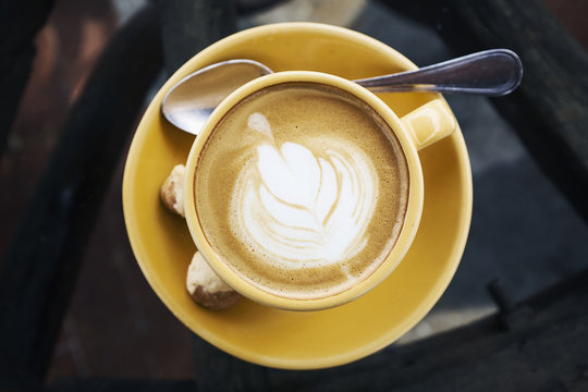 Overhead view of latte with spoon