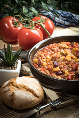 Chili con carne in a clay pan.
