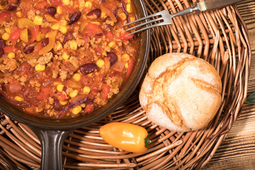 Chili con carne in a clay pan.