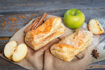 Apple patty on a wooden table. Advertising still life from baking.