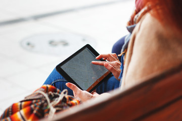 Female fingers touching tablet with map. Travel concept
