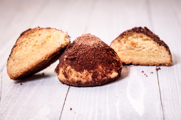 Fototapeta na wymiar Homemade Cookies with chocolate truffle on white wood with defocused background.