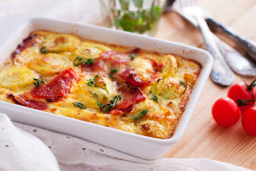 Casserole with sweet potatoes, brussel sprouts, bacon