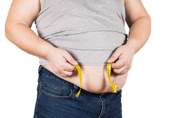 Thick mature man measuring belly yellow measuring tape isolated on white background.