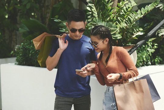 Young Couple Checking Phone