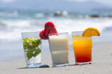 Three kinds of refreshing cocktails at sea in sunny day