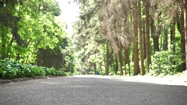 Plogging concept, young girl in hijab runs through park and cleans up garbage. 50 fps