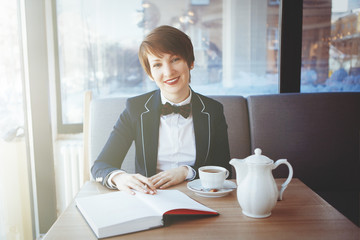 Young business woman in a suit.