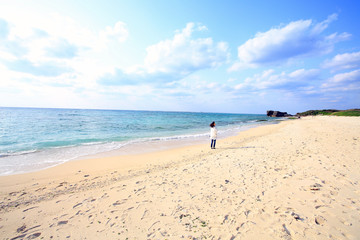 Fototapeta na wymiar woman vacation alone in okinawa beach