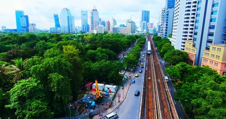 4k.Aerial central park in Bangkok, Thailand green with lake.golf course and business center.Central Park - IN BANGKOK - Lumpini Park - Powered by Adobe