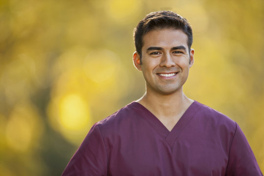 Portrait of a smiling male nurse.