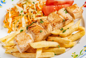 chicken kebabs with french fries
