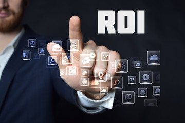 A businessman shows an inscription:ROI