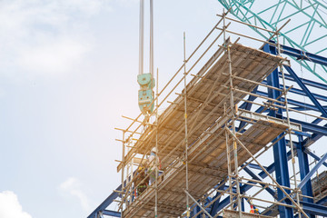 Lots of tower Construction site with cranes and building with blue sky background,scaffolding for construction factory