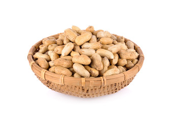 whole roasted peanut in bamboo basket and on white background