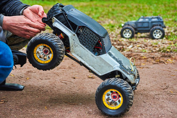 Man is holding Radio-controlled car