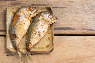 Top view of Fried Mackerel on Wooden Table.