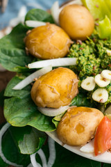 Cooked or backed new potato with fresh vegetables on lunch or dinner. Farm organic products. Raw vegan vegetarian healthy food