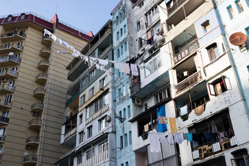 Batumi city in Adjaria, Georgia. Colorful drying clothes of local people hanging on ropes on the streets. City of black sea tourism.