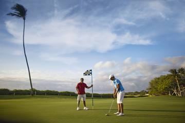 Couple playing golf together.