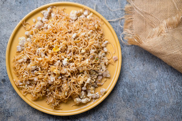 Stir fried instant noodle with minced pork and egg