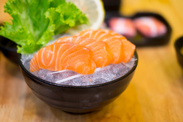 Raw salmon slice or salmon sashimi