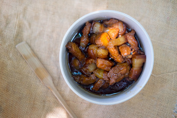 Streaky pork sweet stewed in white bowl