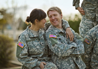 US Army soldiers relax together after a training exercise.