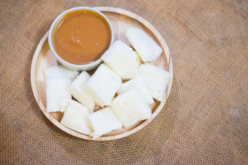 Fototapeta na wymiar Orange pandan custard and steamed bread plate