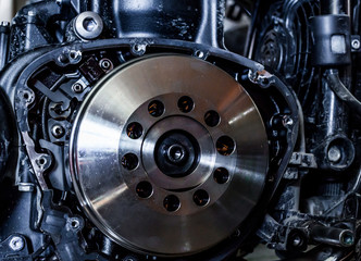 motorcycle service clutch disc repair close up soft light conditions