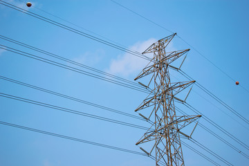  High voltage electric pole on beautiful sky background.