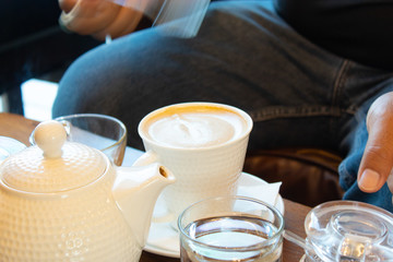 Hot coffee Put a glass of white with a casual break from work