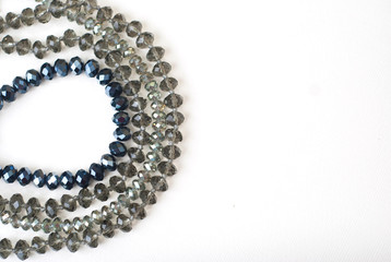 Colorful Shinny Crystal Beads Glass Isoalted on White Background Copy space for Text Fashion Beauty