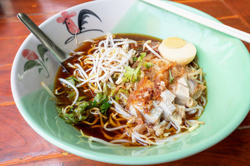 Crispy Pork noodles with egg in big bowl