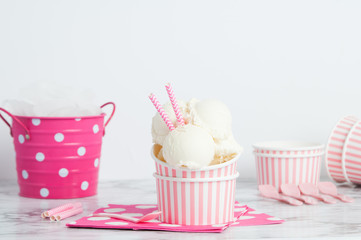 vanillia ice cream in a pink styled setting