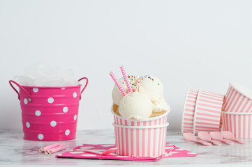 vanillia ice cream in a pink styled setting