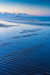 Fototapeta na wymiar LLigwy Beach near Moelfre, Anglesey North Wales at sunset.