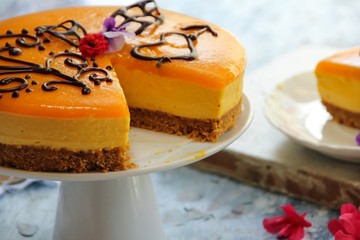 Slice of homemade Mango Mousse cake , selective focus