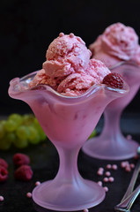 Raspberry ice cream balls on a black background