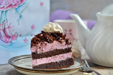 A piece of chocolate mud cake with cream