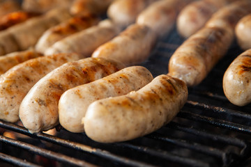 Grilled meat sausages on charcoal grill