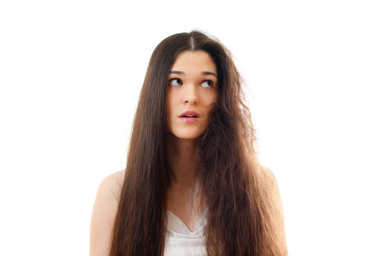 Young woman with well-groomed combed and problem unkempt hair. White background close up