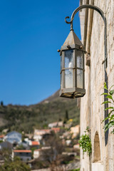 Old metal lamp on the fortress wall
