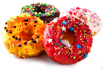 Set of colored donuts on a white background (close up)