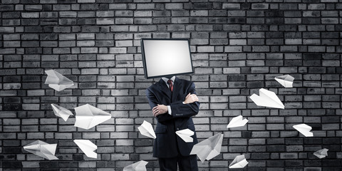 Businessman with TV instead of head.