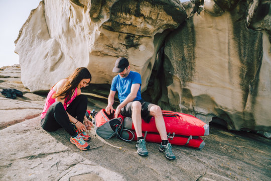 Young Couple Getting Ready For Climbing