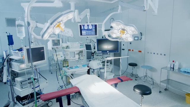 Establishing Shot of Technologically Advanced Operating Room with No People, Ready for Surgery. Real Modern Operating TheaterWith Working Equipment. Shot on RED EPIC-W 8K.