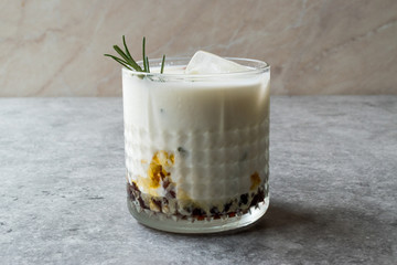 Salted Caramel White Russian Cocktail with Rosemary and Ice.